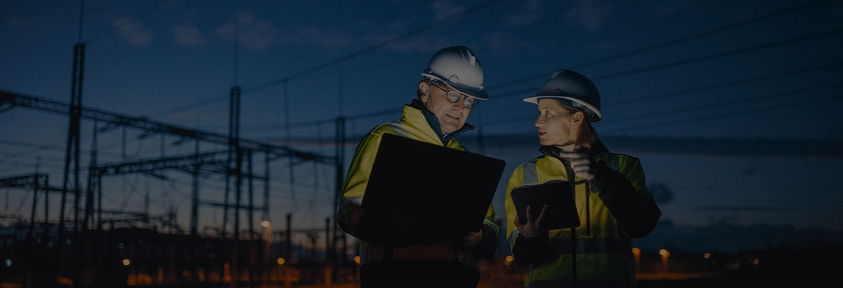 Utility workers at night