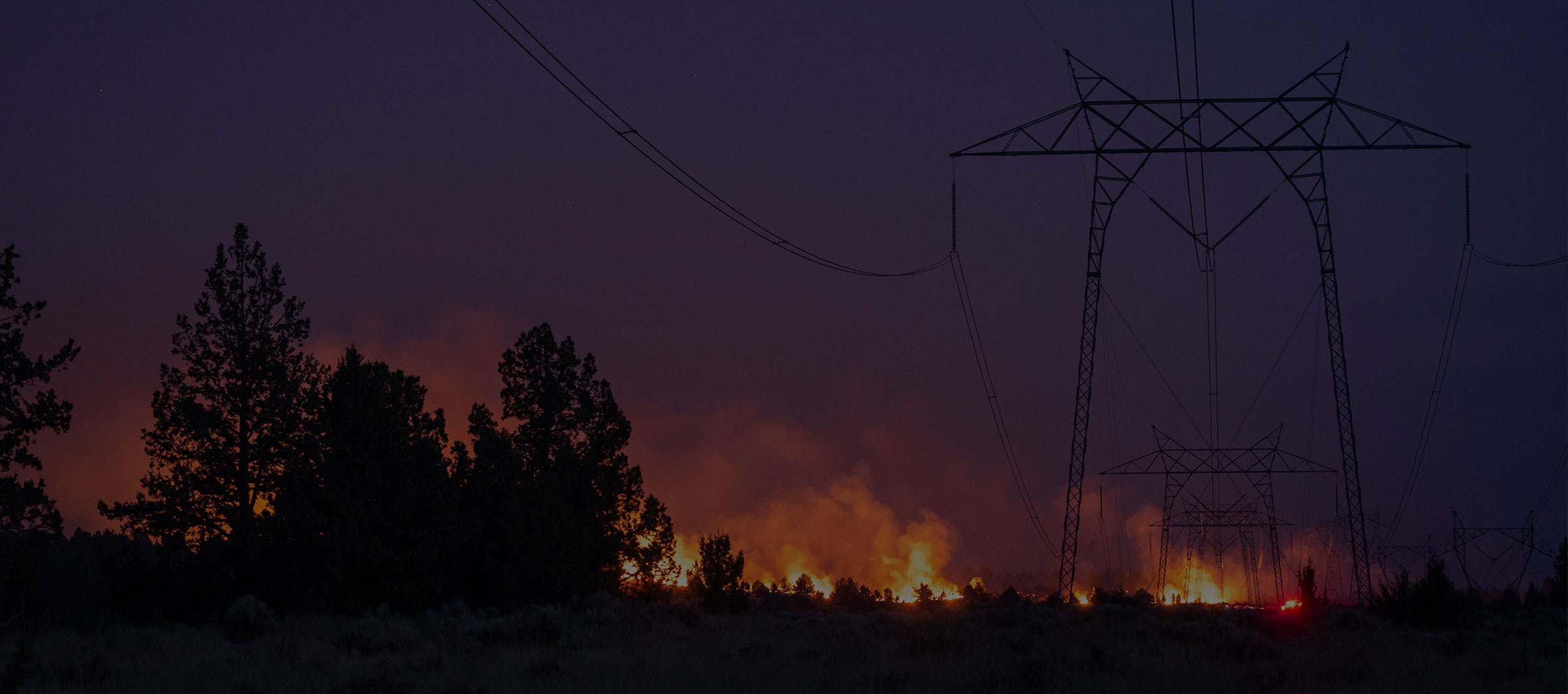 wildfire burning near power lines