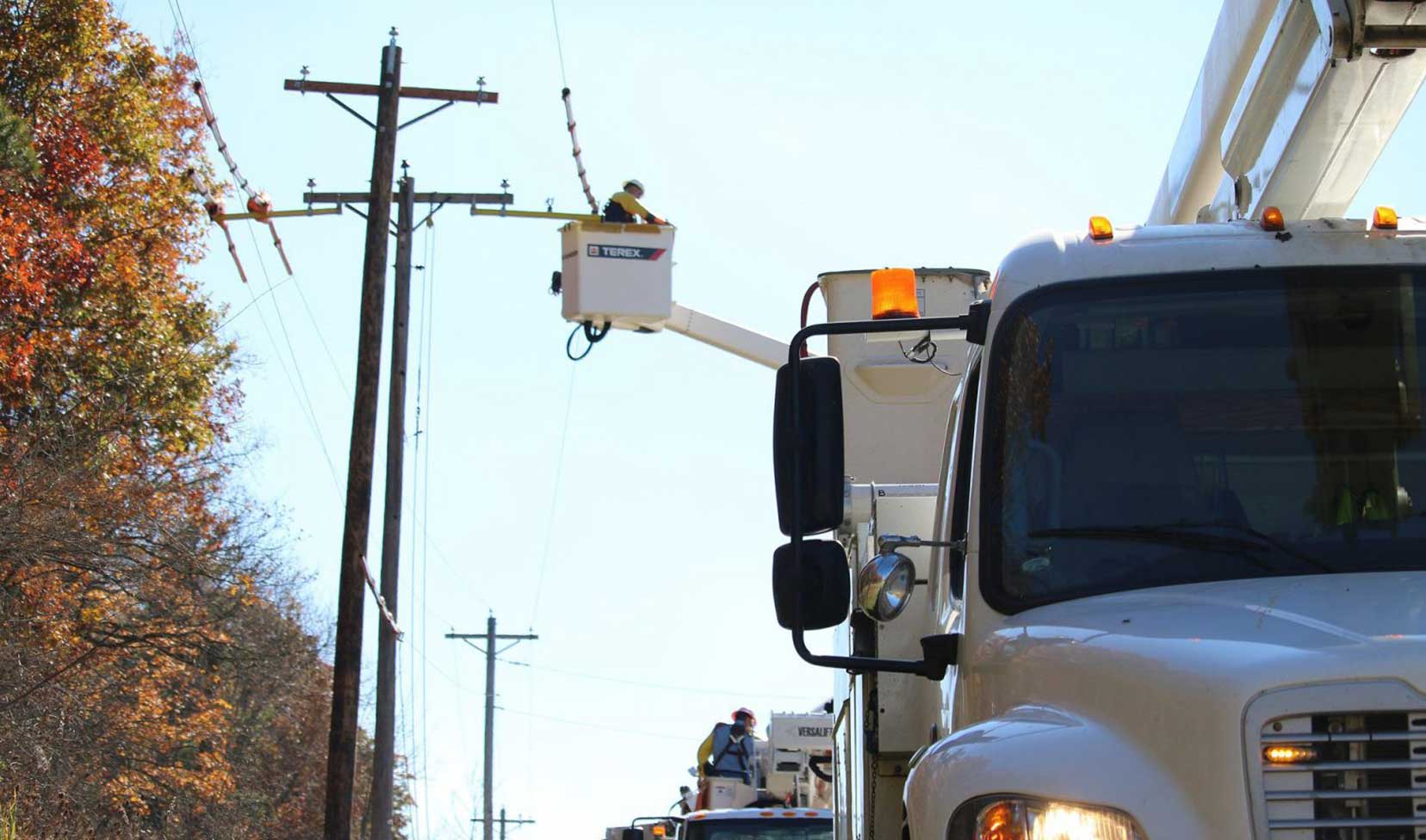 Utility Crew in a list working on power lines
