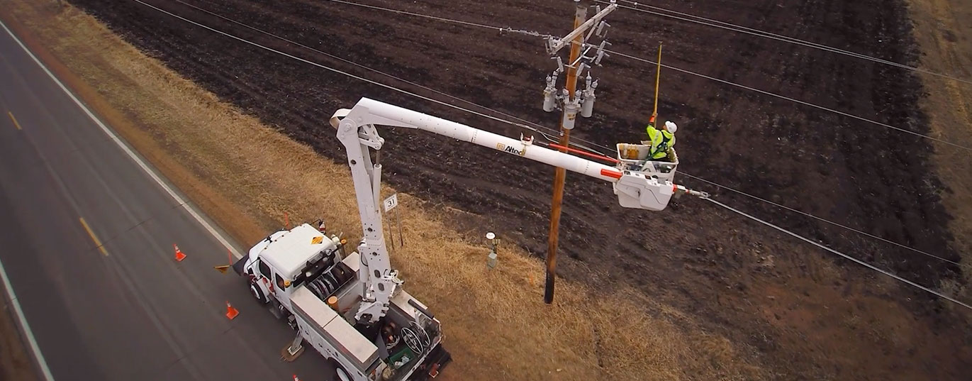 utility workers updating power lines